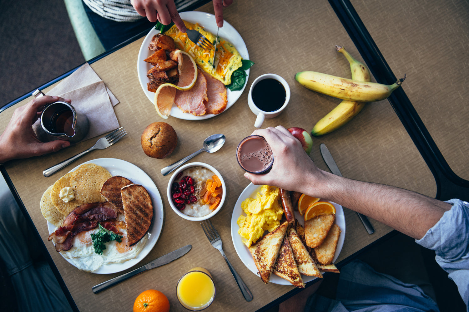 Above view of a delicious breakfast spread with a variety of dishes and ingredients.